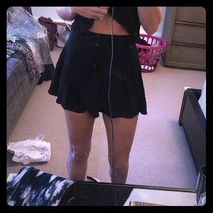 Black mini skirt with buttons